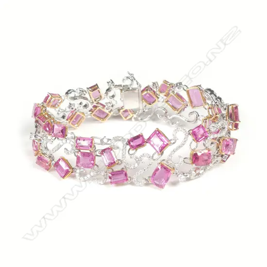 A fancy 18ct. white gold rubellite and diamond set wide bracelet