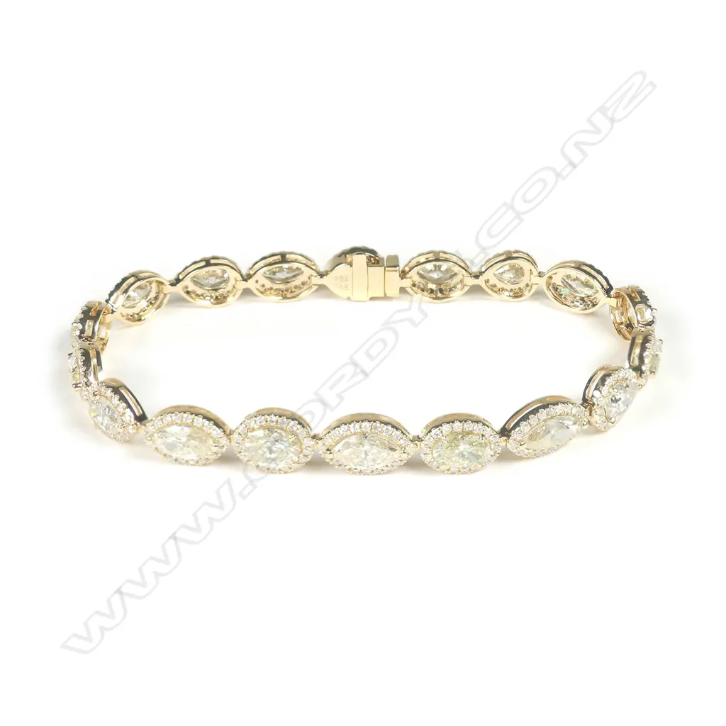 A 14ct gold diamond halo bracelet Image 1++