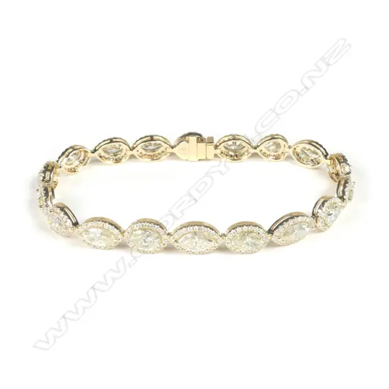 A 14ct gold diamond halo bracelet