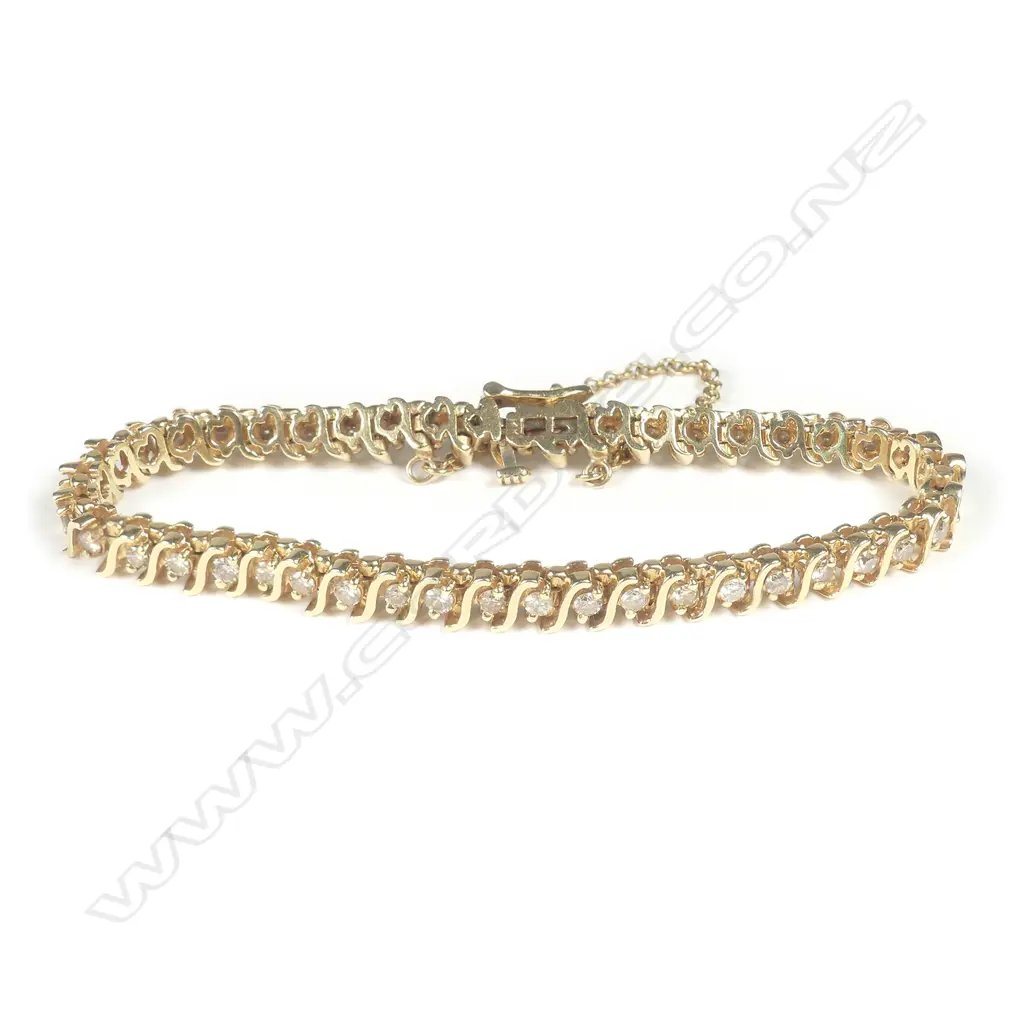 A 14ct gold and diamond bracelet Image 1++