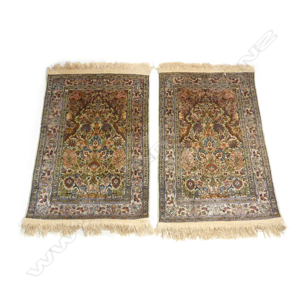 A pair of small hand knotted silk pile wall rugs Image 1++