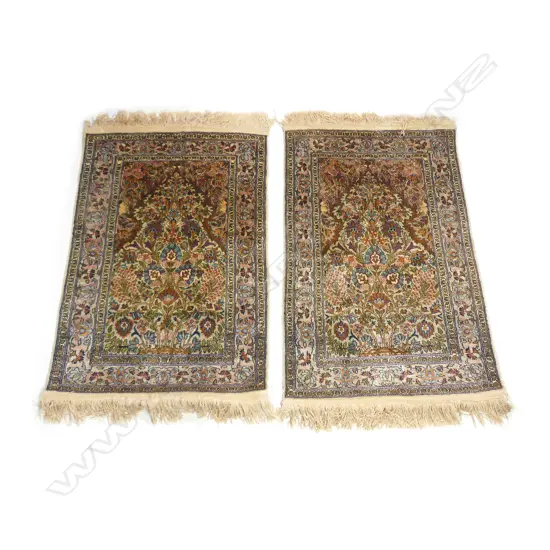 A pair of small hand knotted silk pile wall rugs
