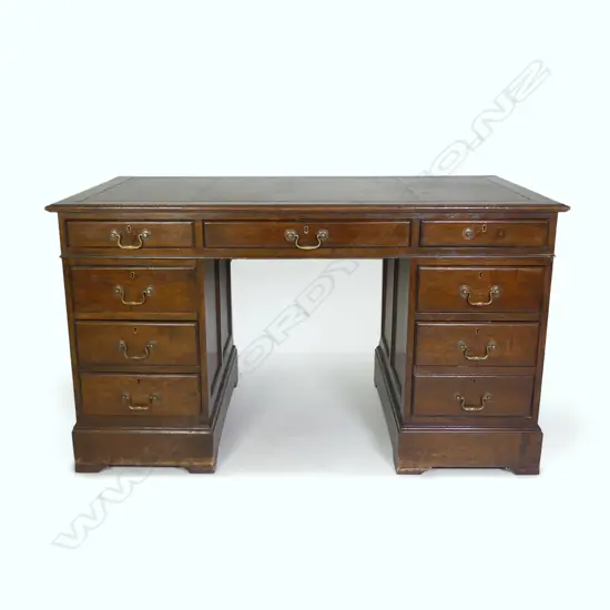A Victorian oak twin pedestal desk
