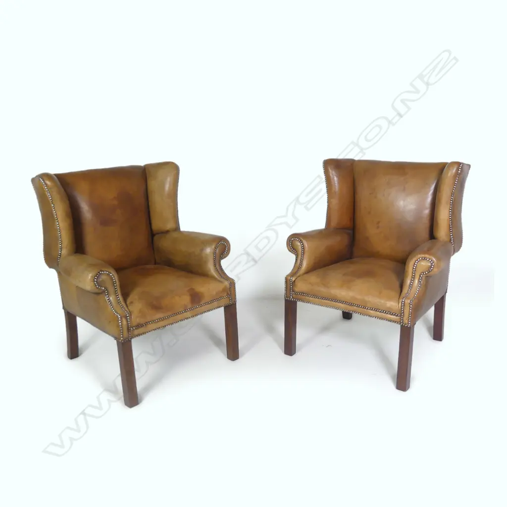 A pair of vintage leather wingback armchairs Image 1++