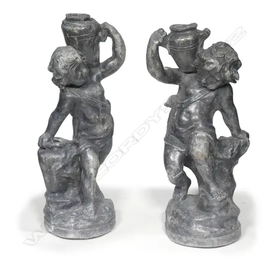 A pair of early Georgian lead garden statuettes