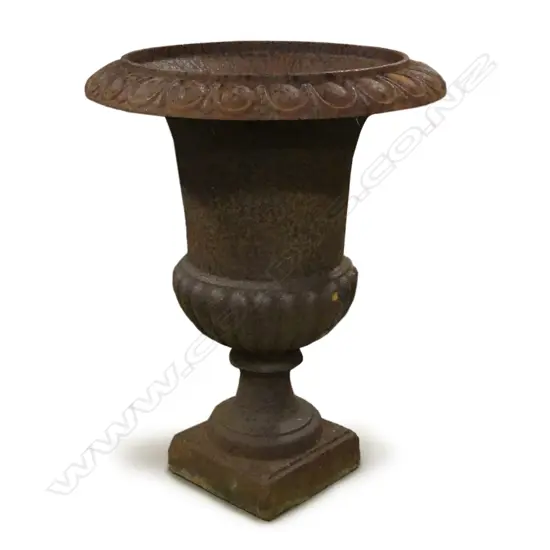 A cast iron garden urn