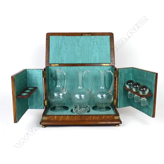 A Victorian quartered oak decanter case