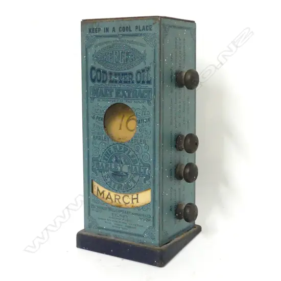 A tin plate advertising desk top perpetual calendar