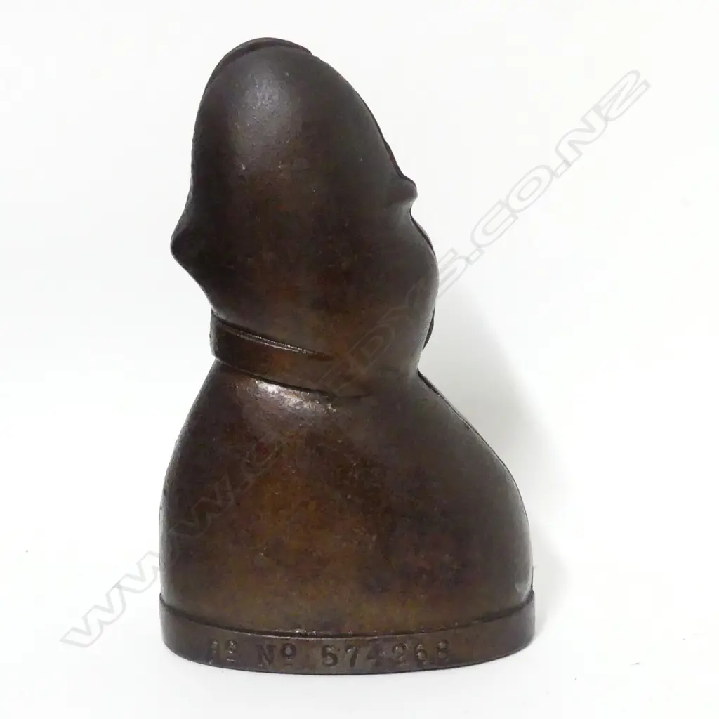 A cast iron money bank 'Every Copper Helps' Image 1++