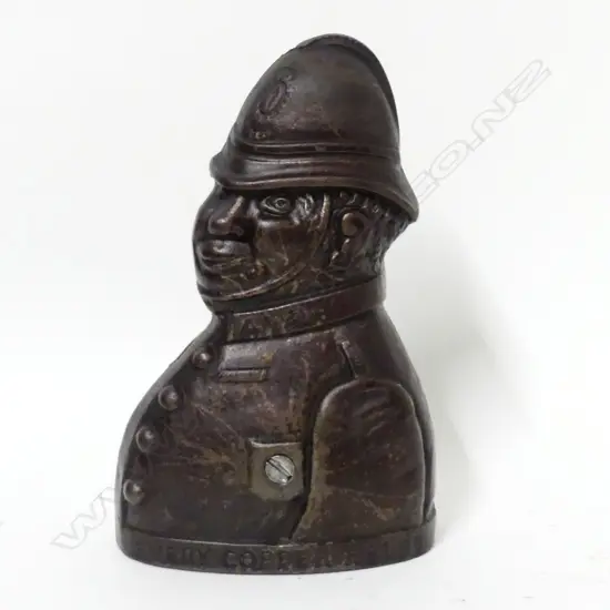 A cast iron money bank 'Every Copper Helps'