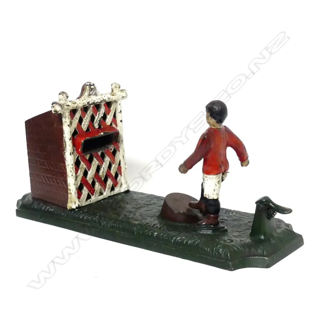 A vintage cast iron money bank Image 1++