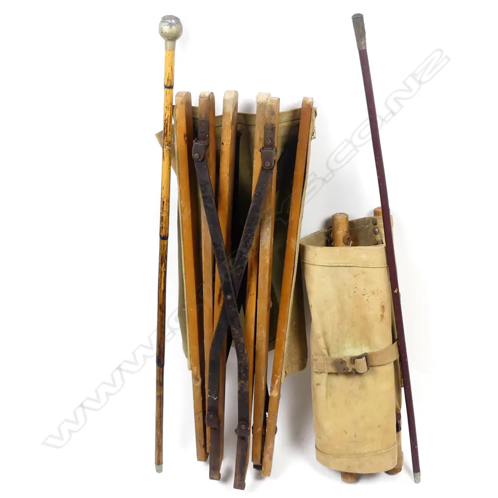 A WWII military canvas and wood folding chair Image 1++