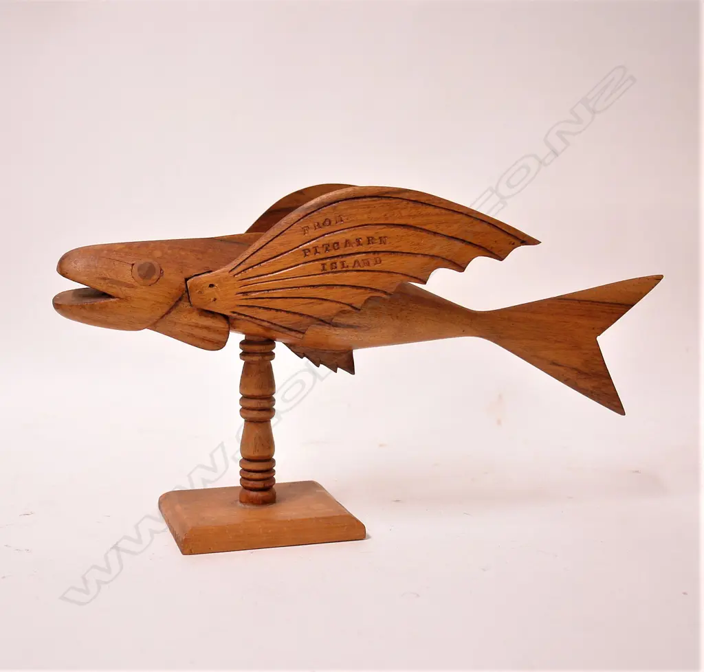 An old Pitcairn Island carved wood flying fish on stand Image 1++