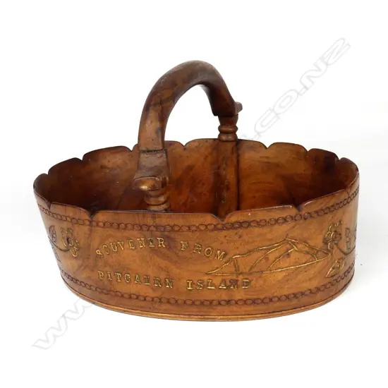 An uncommon vintage Pitcairn Island miro wood handled basket