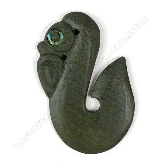 A green stone manaia/matau pendant
