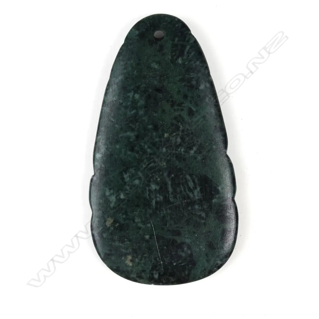 A pounamu koruru pendant carved by Mike Higgs Image 1++