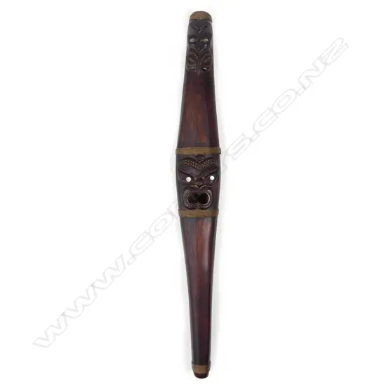 A mid-late 20thC Maori carved putorino (bugle flute)