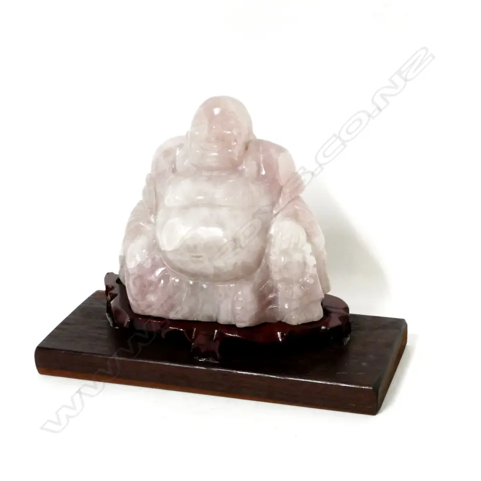 A pink quartz carved Buddha in glazed and mirrored case Image 1++