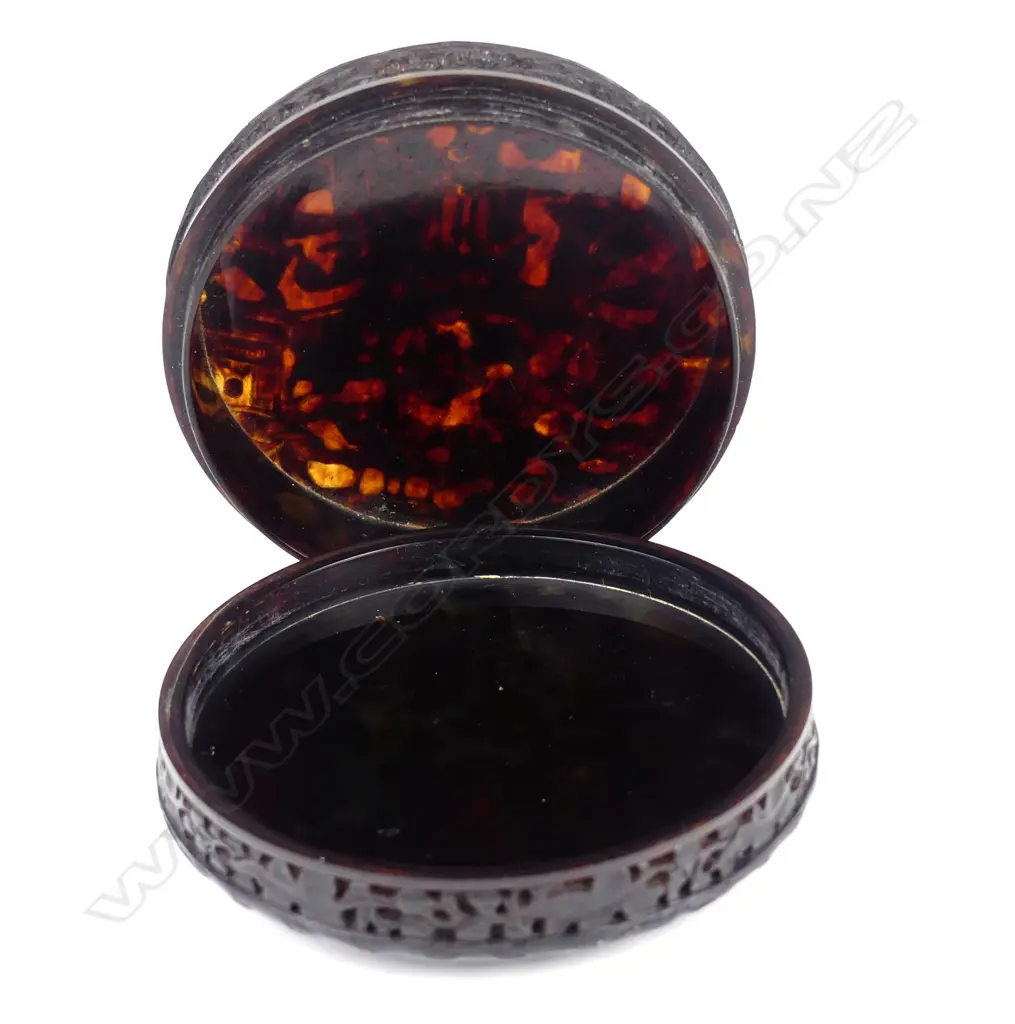 A finely Chinese carved tortoiseshell Qing period circular table snuff box Image 1++