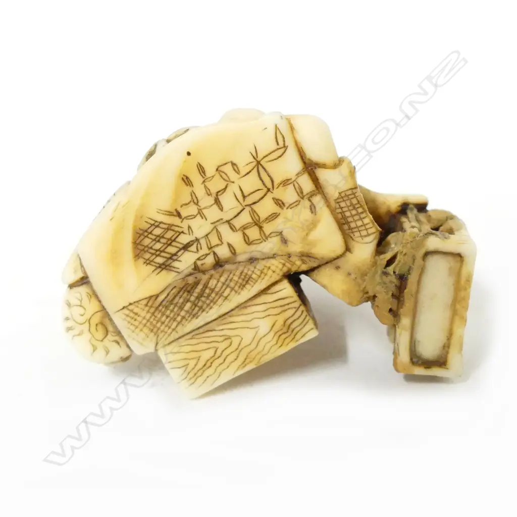 A small Japanese ivory carving of a young boy rat catcher Image 1++