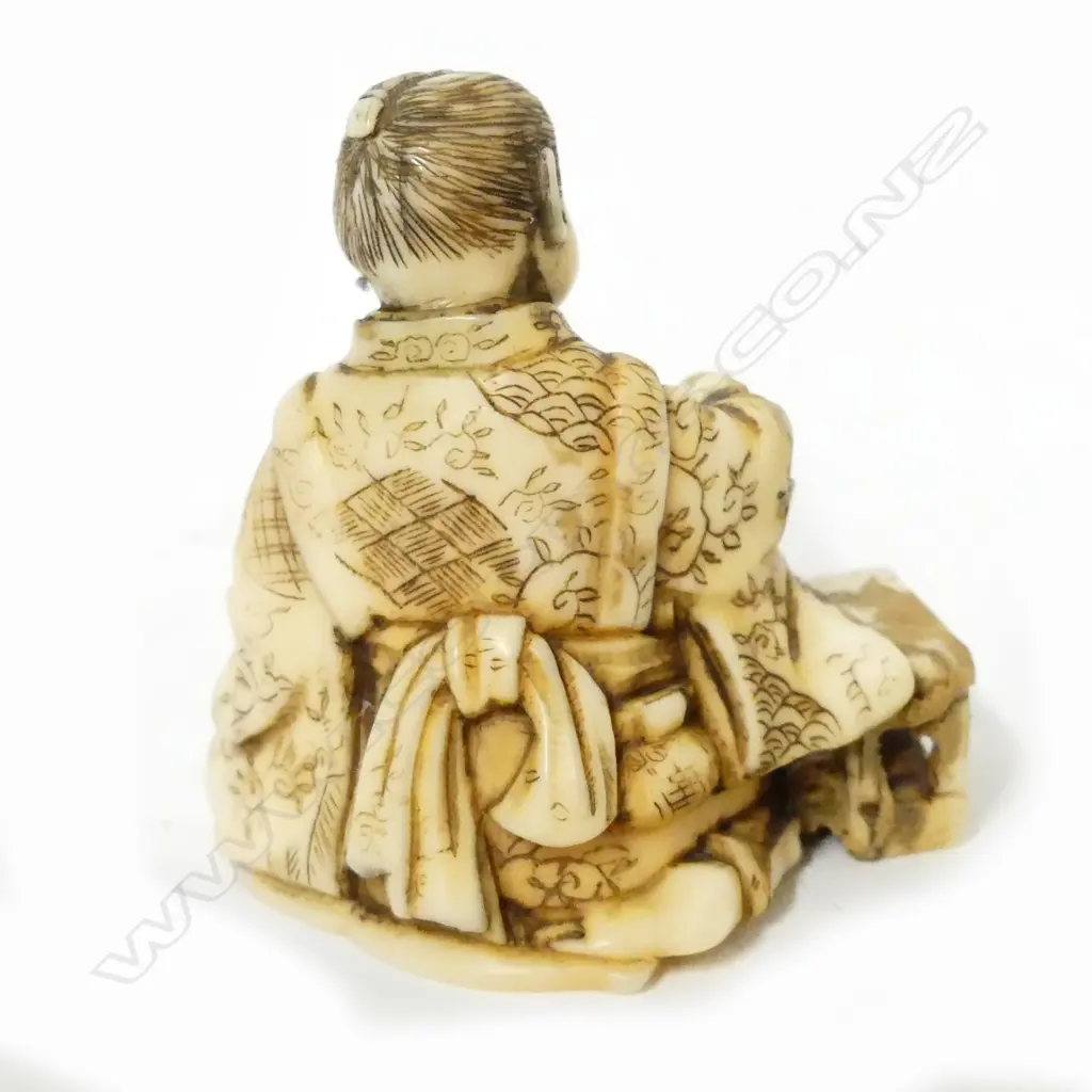 A small Japanese ivory carving of a young boy rat catcher Image 1++