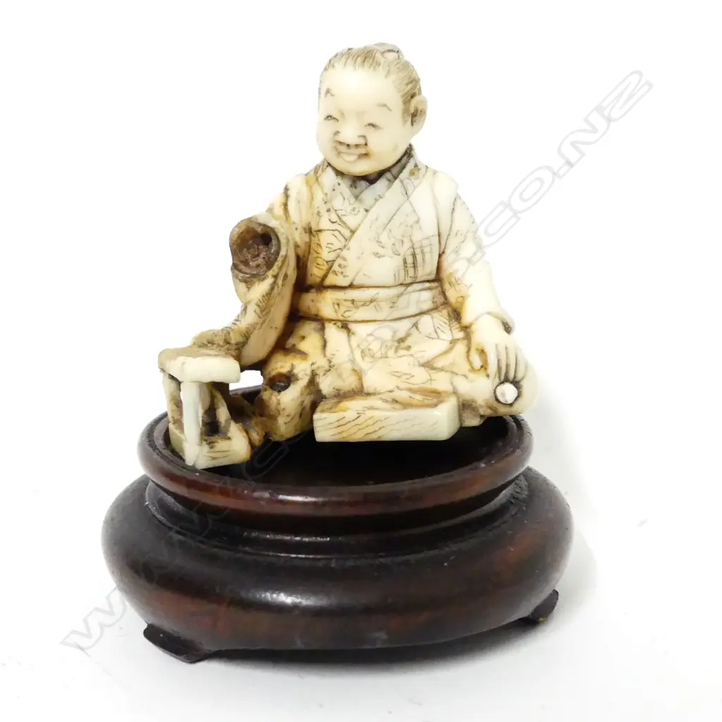A small Japanese ivory carving of a young boy rat catcher Image 1++