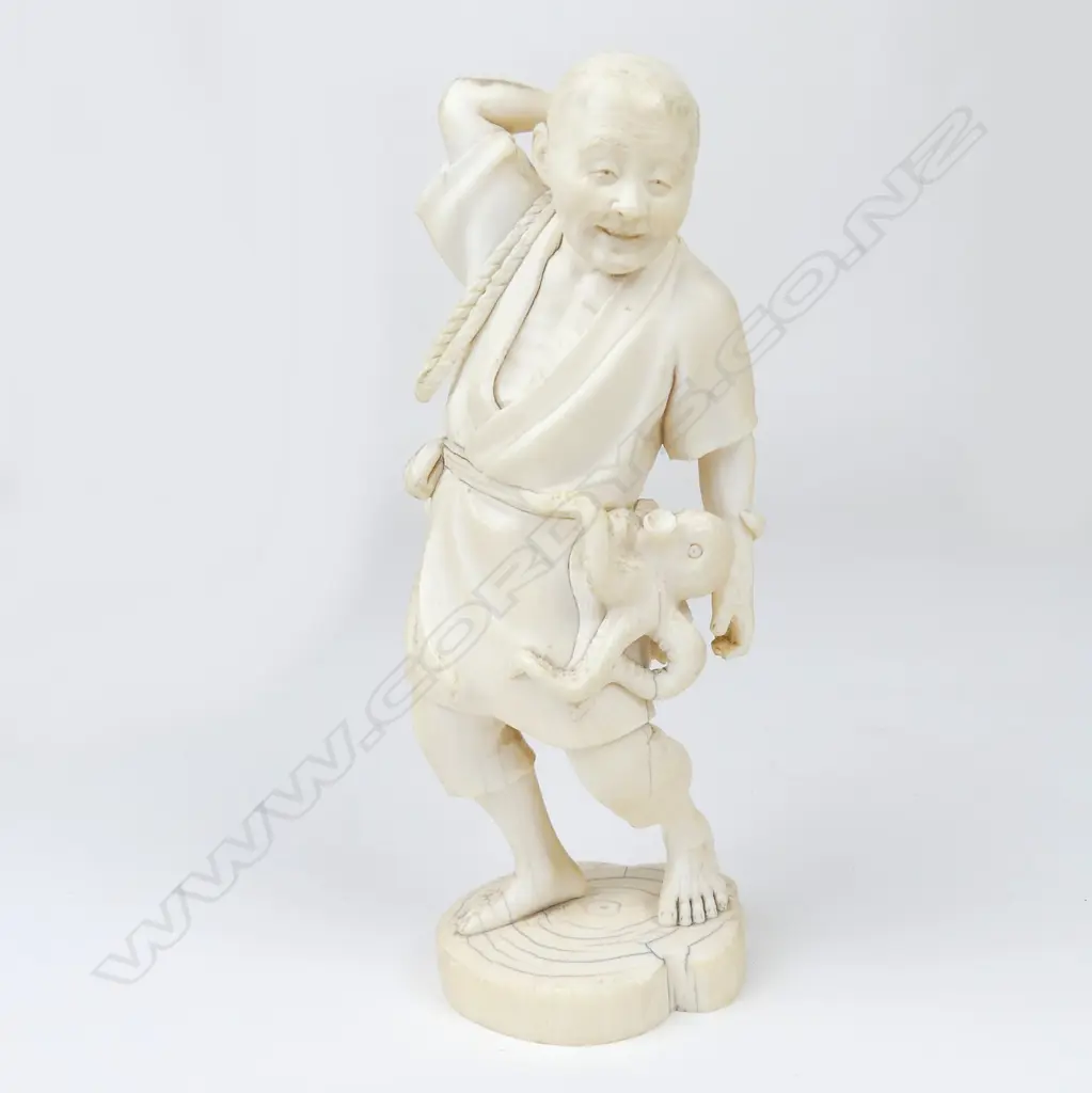 A Meiji period ivory figure of a fisherman Image 1++
