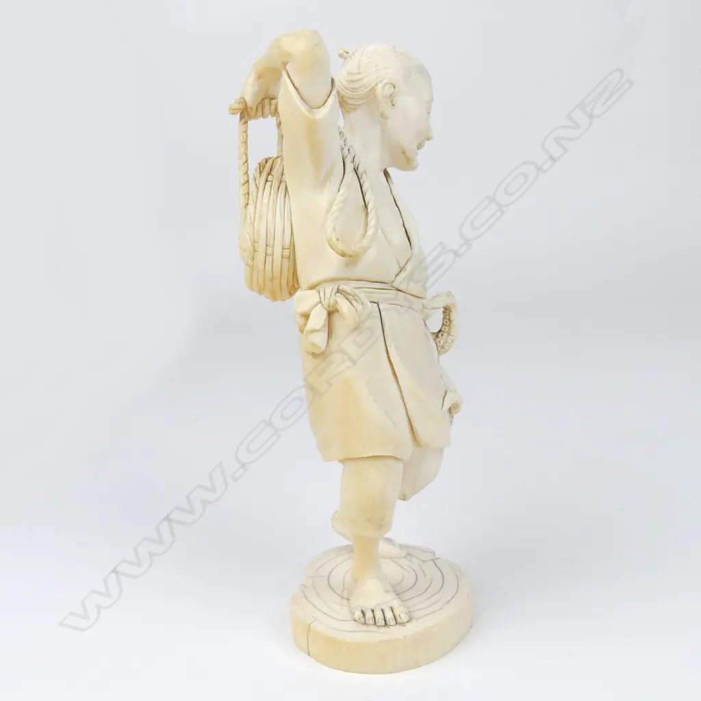 A Meiji period ivory figure of a fisherman Image 1++