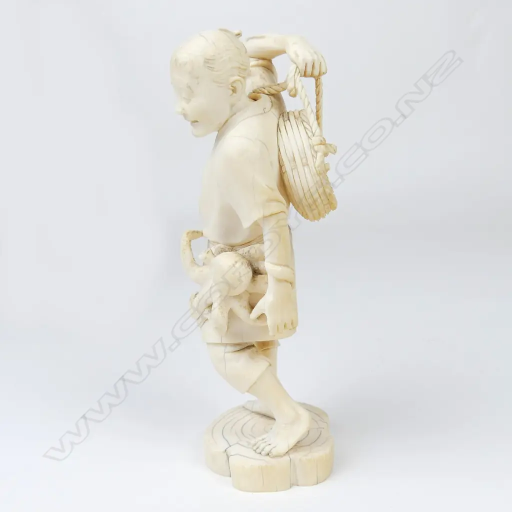A Meiji period ivory figure of a fisherman Image 1++