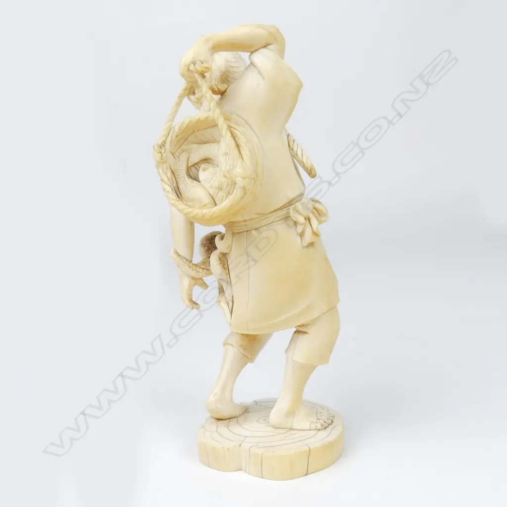 A Meiji period ivory figure of a fisherman Image 1++