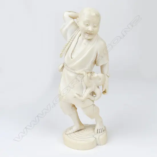 A Meiji period ivory figure of a fisherman