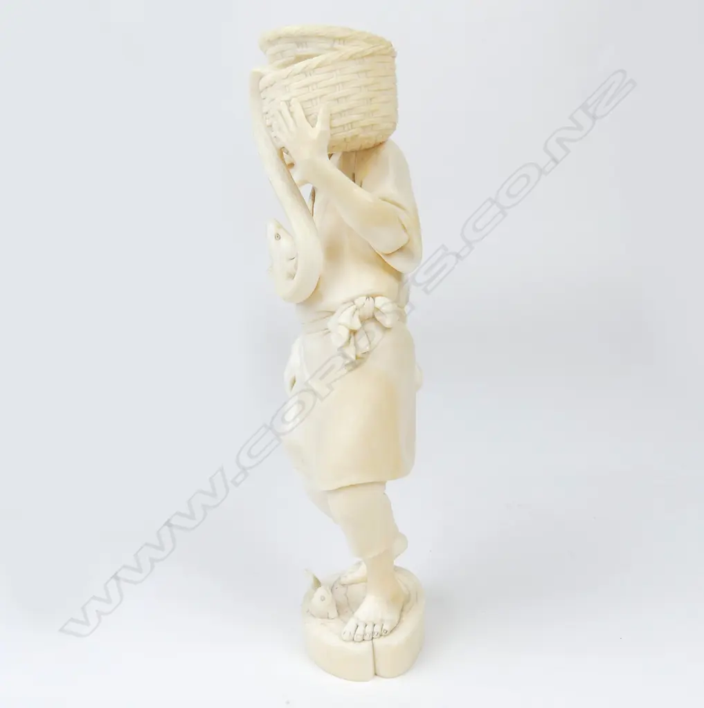 A Meiji period ivory figure of a fisherman Image 1++