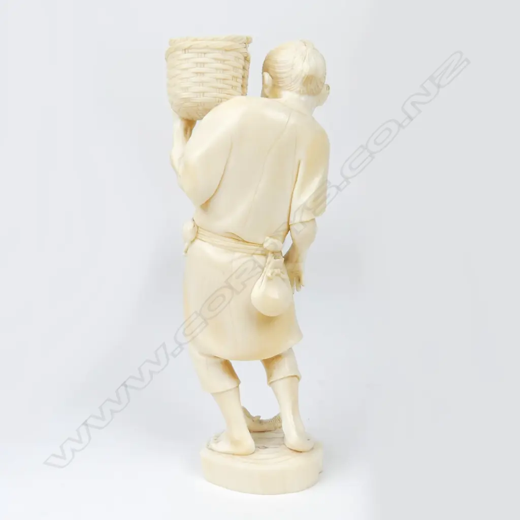 A Meiji period ivory figure of a fisherman Image 1++