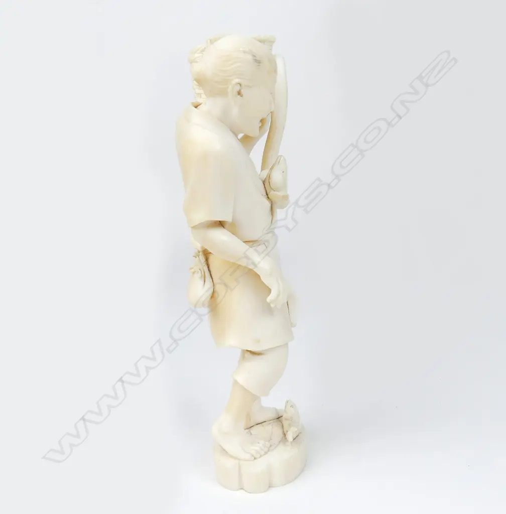A Meiji period ivory figure of a fisherman Image 1++