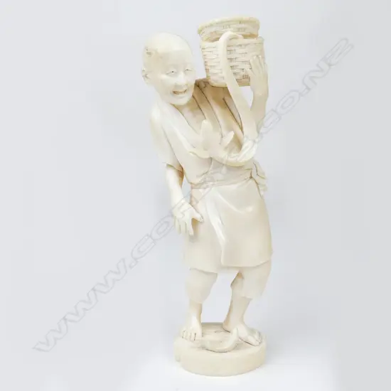A Meiji period ivory figure of a fisherman