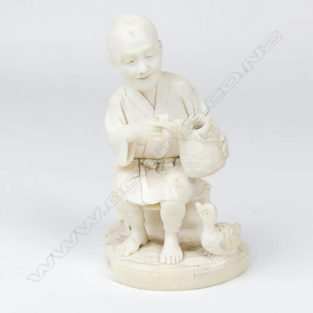 A Meiji period ivory figure of an elderly man Image 1++
