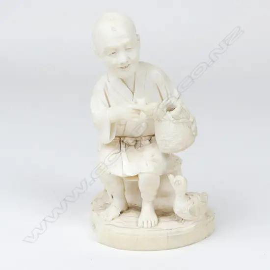 A Meiji period ivory figure of an elderly man