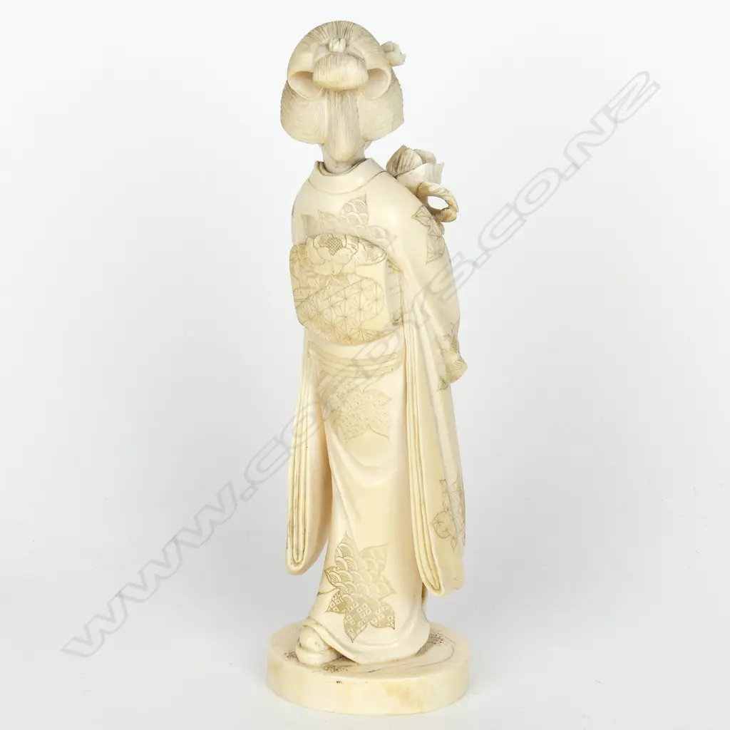 A Japanese Meiji period ivory figure of a woman Image 1++
