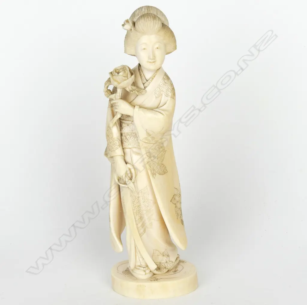 A Japanese Meiji period ivory figure of a woman Image 1++