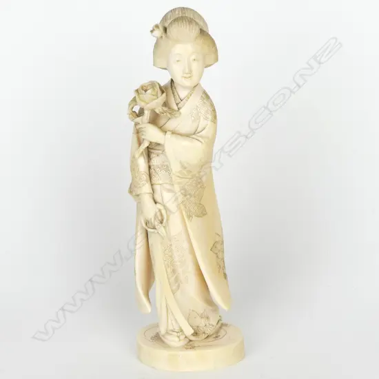 A Japanese Meiji period ivory figure of a woman