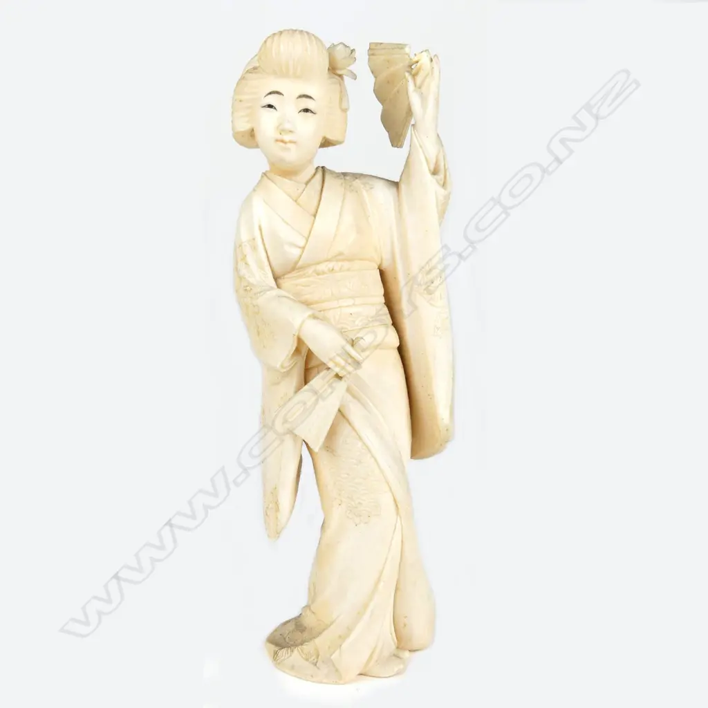 A Japanese Meiji period ivory figure of a woman Image 1++