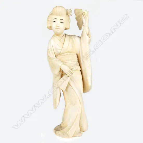 A Japanese Meiji period ivory figure of a woman
