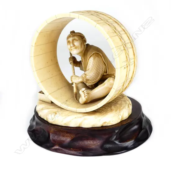 An outstanding Japanese Meiji period okimono of a barrel maker