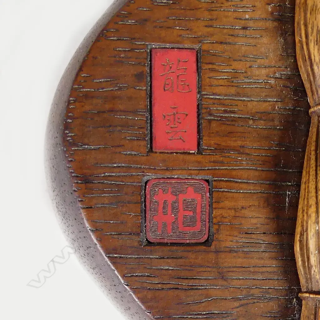 A Japanese Meiji period boxwood and ivory okimono of two swordsmiths Image 1++