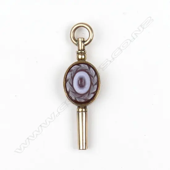 A 9ct rose gold watch key