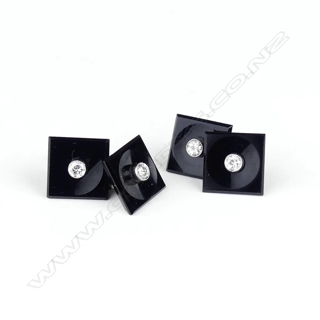 A pair of platinum onyx and diamond cufflinks Image 1++