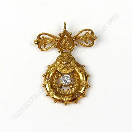 An antique 14ct. yellow gold and diamond suspended pendant brooch
