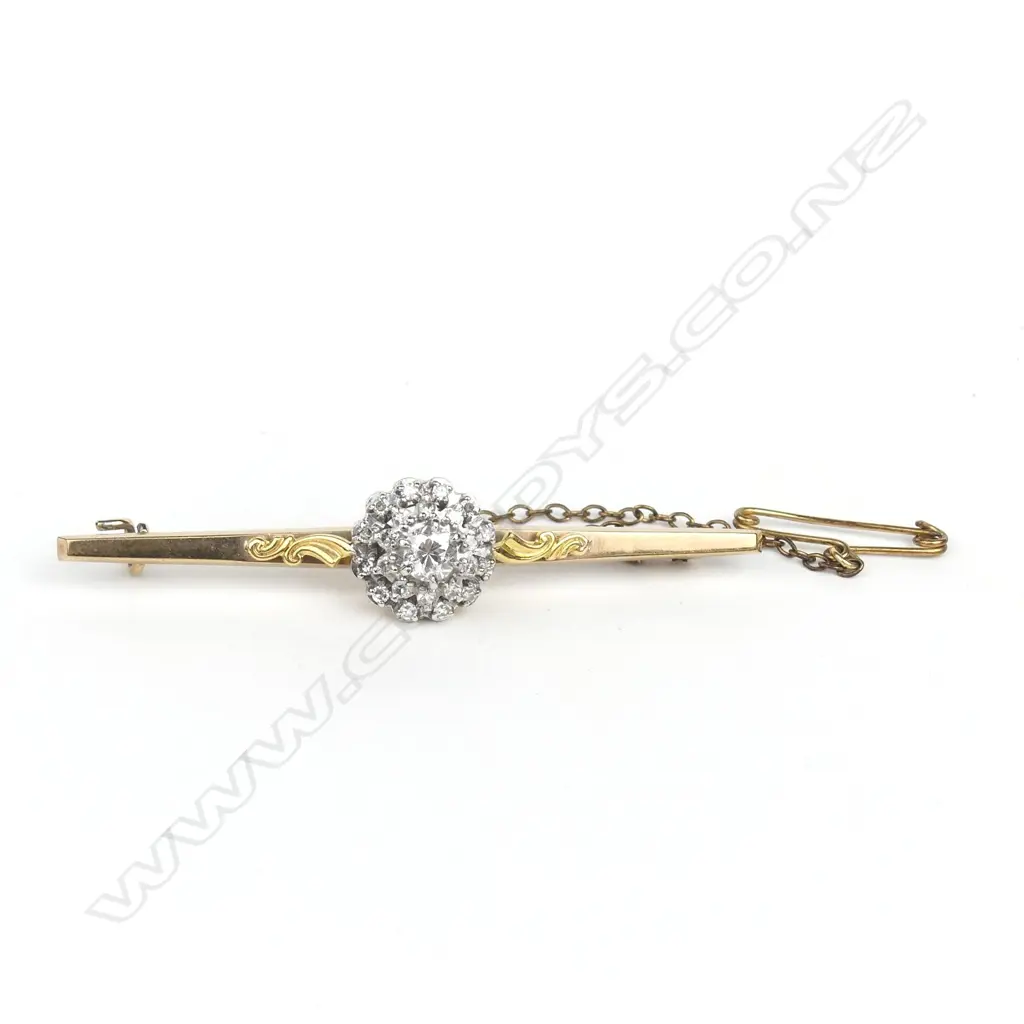 An 18ct gold and 9ct gold diamond bar brooch Image 1++