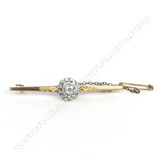 An 18ct gold and 9ct gold diamond bar brooch