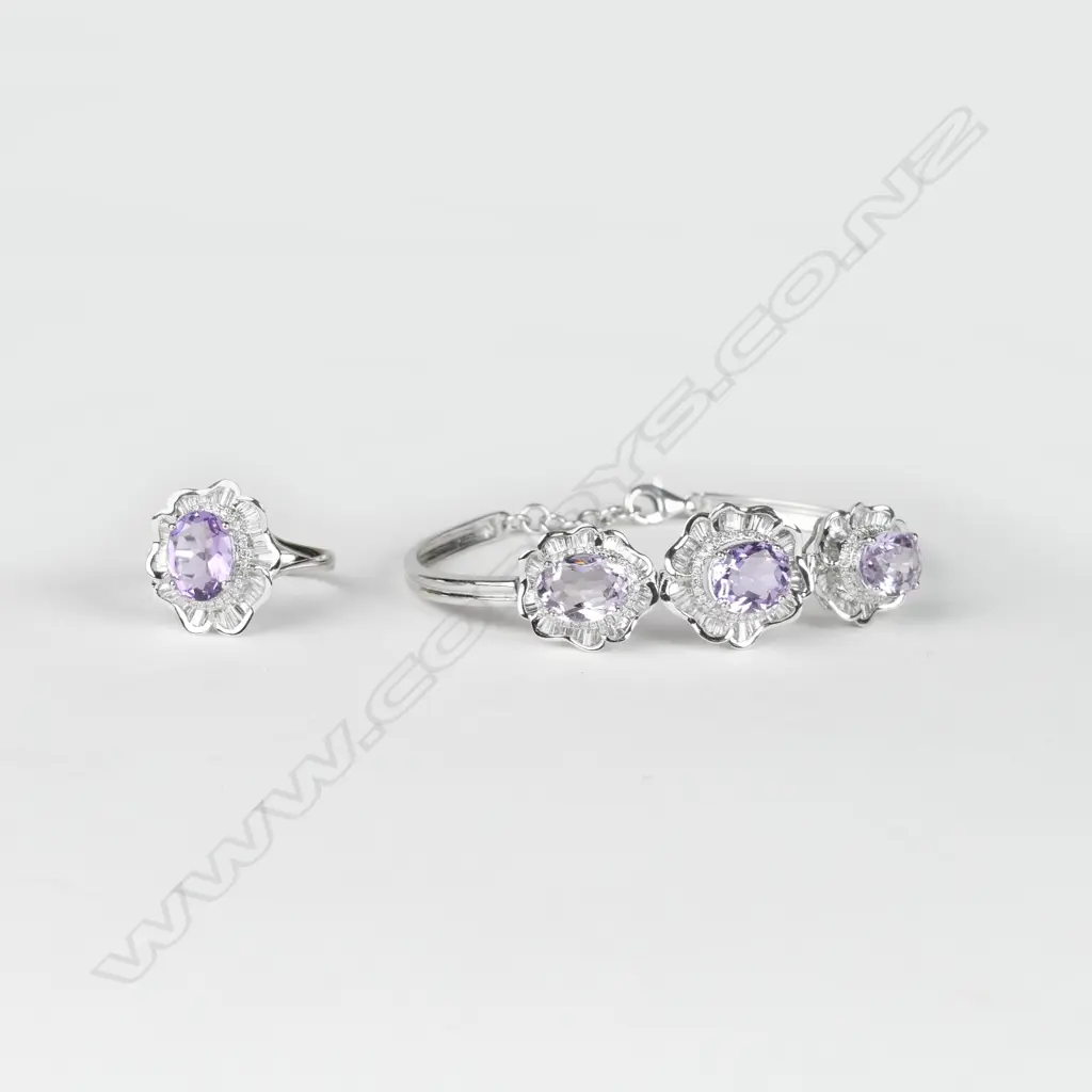 A modern 18ct. white gold amethyst and diamond ring and matching bracelet Image 1++
